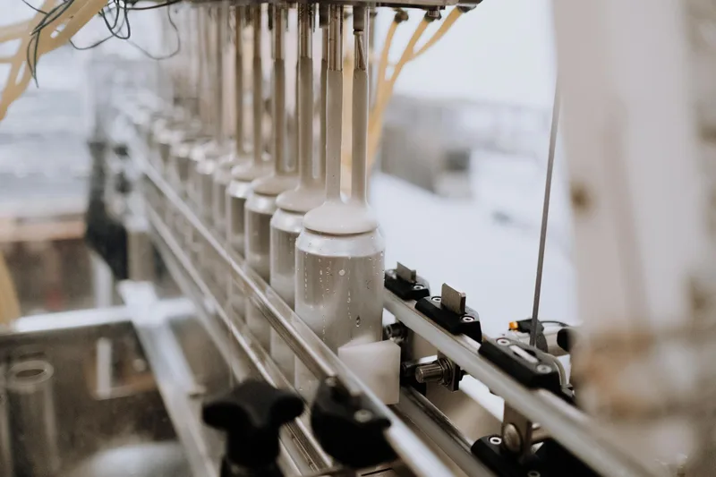 Factory conveyor belt representing the scale and throughput of automated business processes